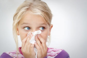 Child shivering from summer allergens