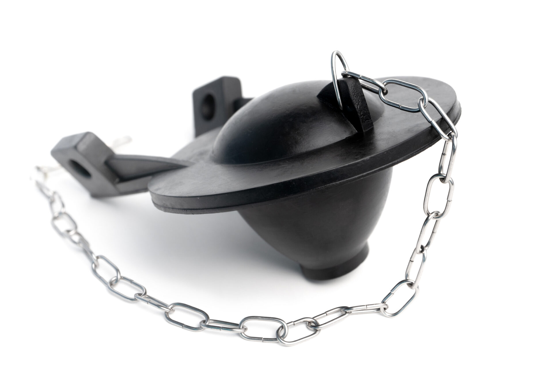 Replaced toilet flapper installed inside a toilet tank.