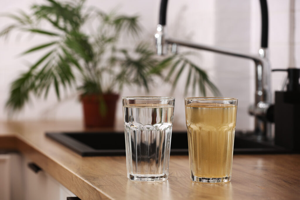 Discolored tap water with sediment indicating poor water quality.