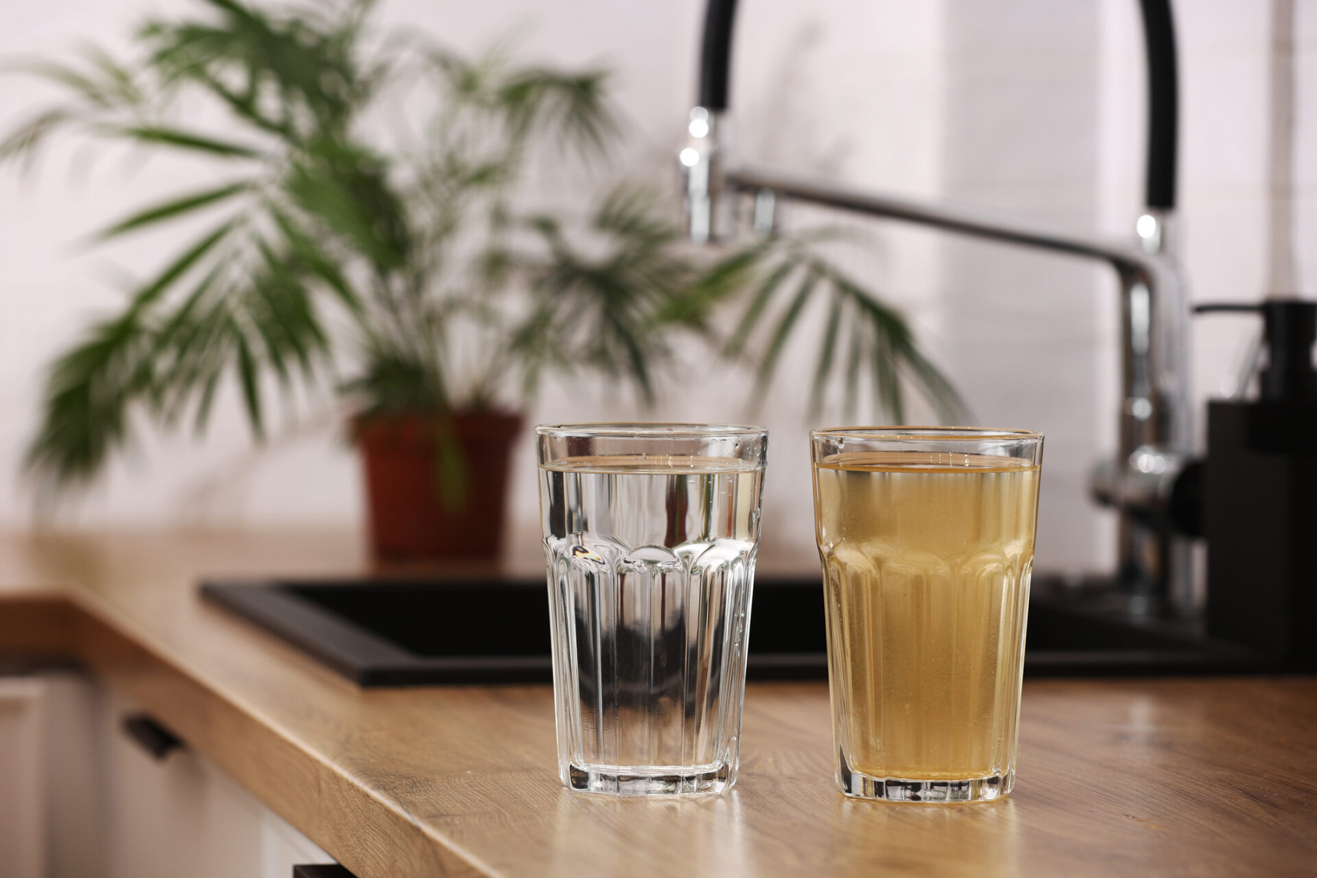 Discolored tap water with sediment indicating poor water quality.
