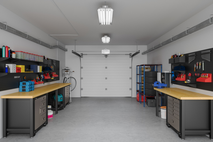 Interior of a garage workshop with tools and workbench.