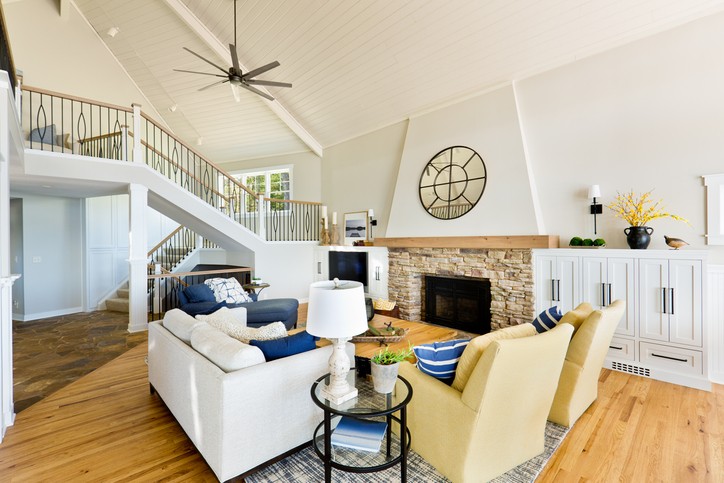 Ceiling fan in a modern living room helping reduce heating costs