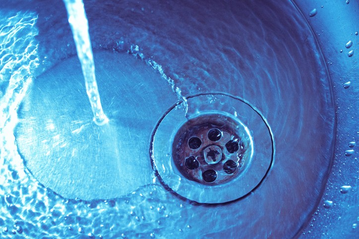 Kitchen sink draining slowly during winter due to cold weather pipe buildup
