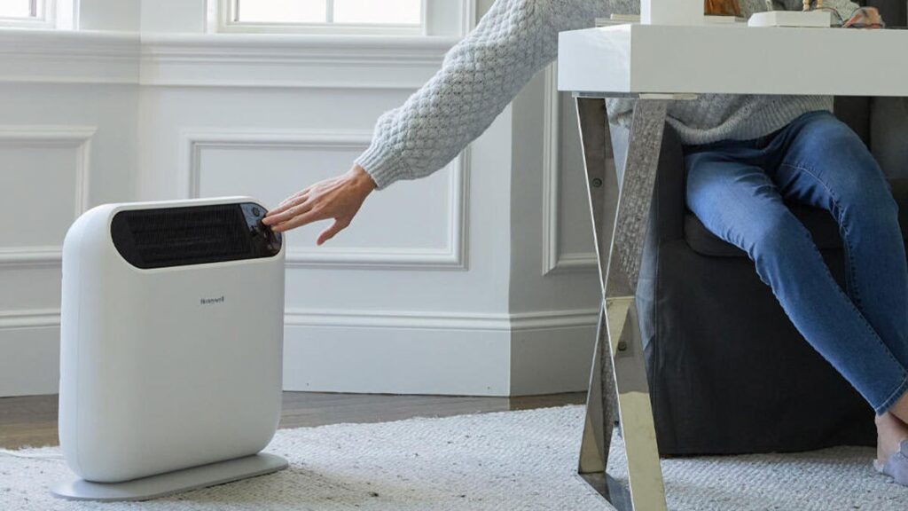 Space heater placed too close to curtains in a living room during winter, highlighting fire risk.