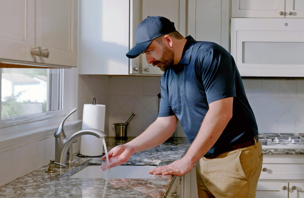 plumber in kitchen