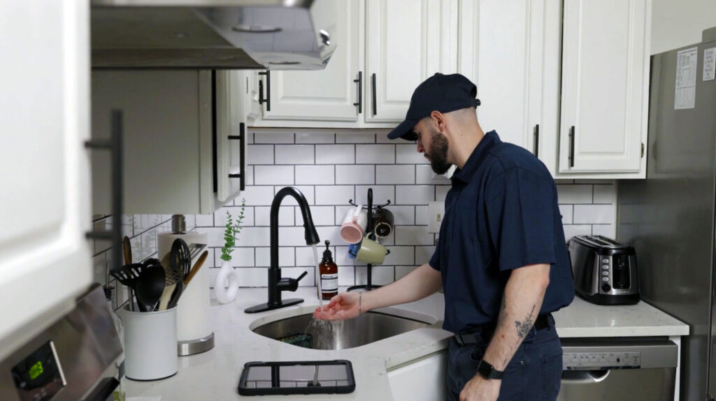 plumber in kitchen