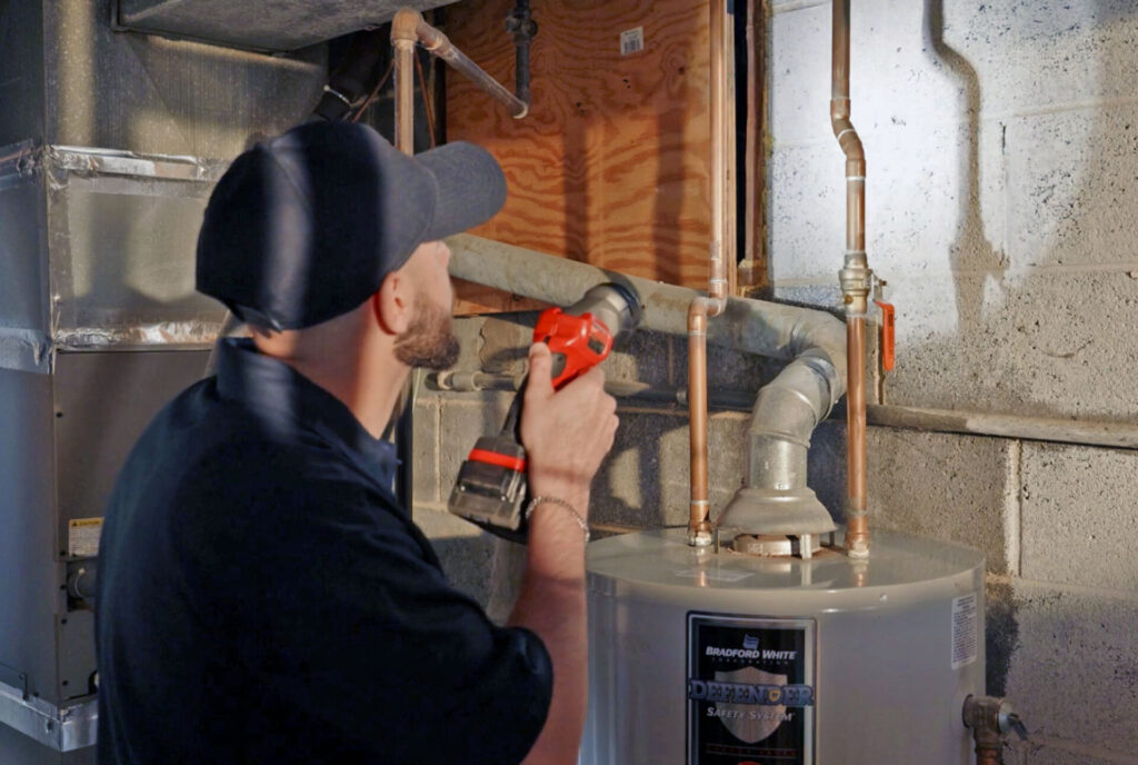 plumber inspecting water heater