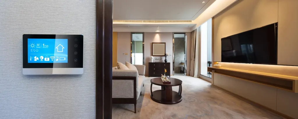 Smart home automation control panel mounted on wall with luxury living room in background