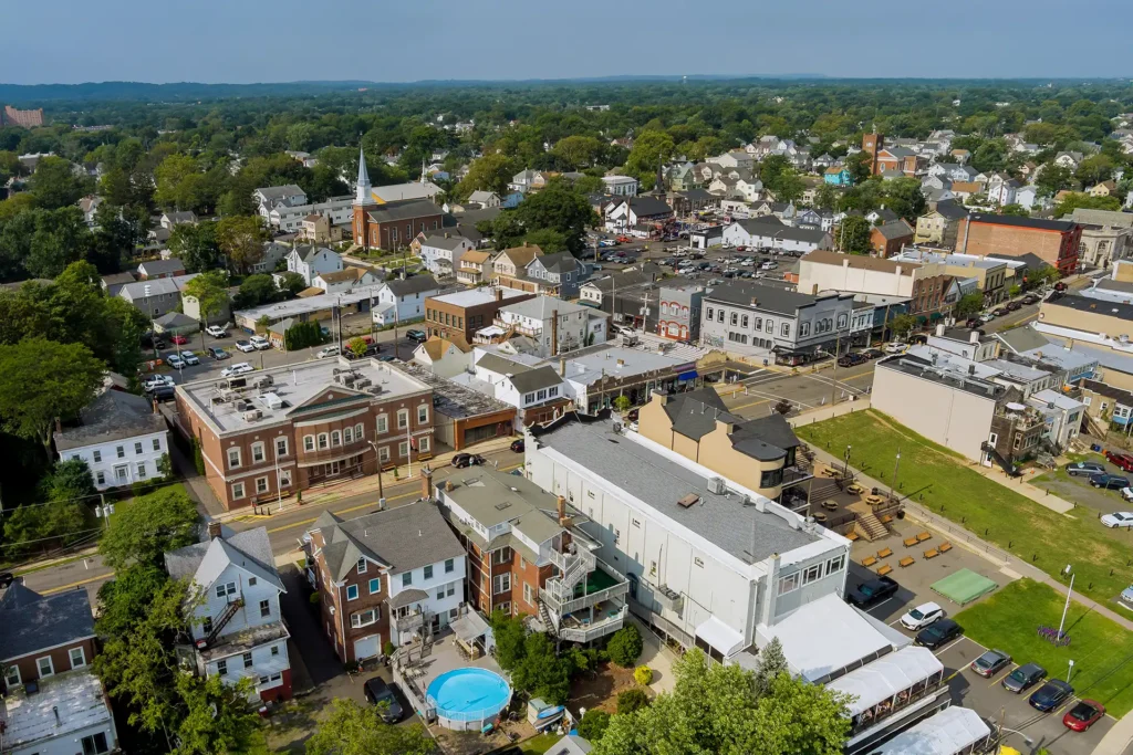 Aerial view of East Brunswick, New Jersey downtown area with churches, shops, and residential neighborhoods
